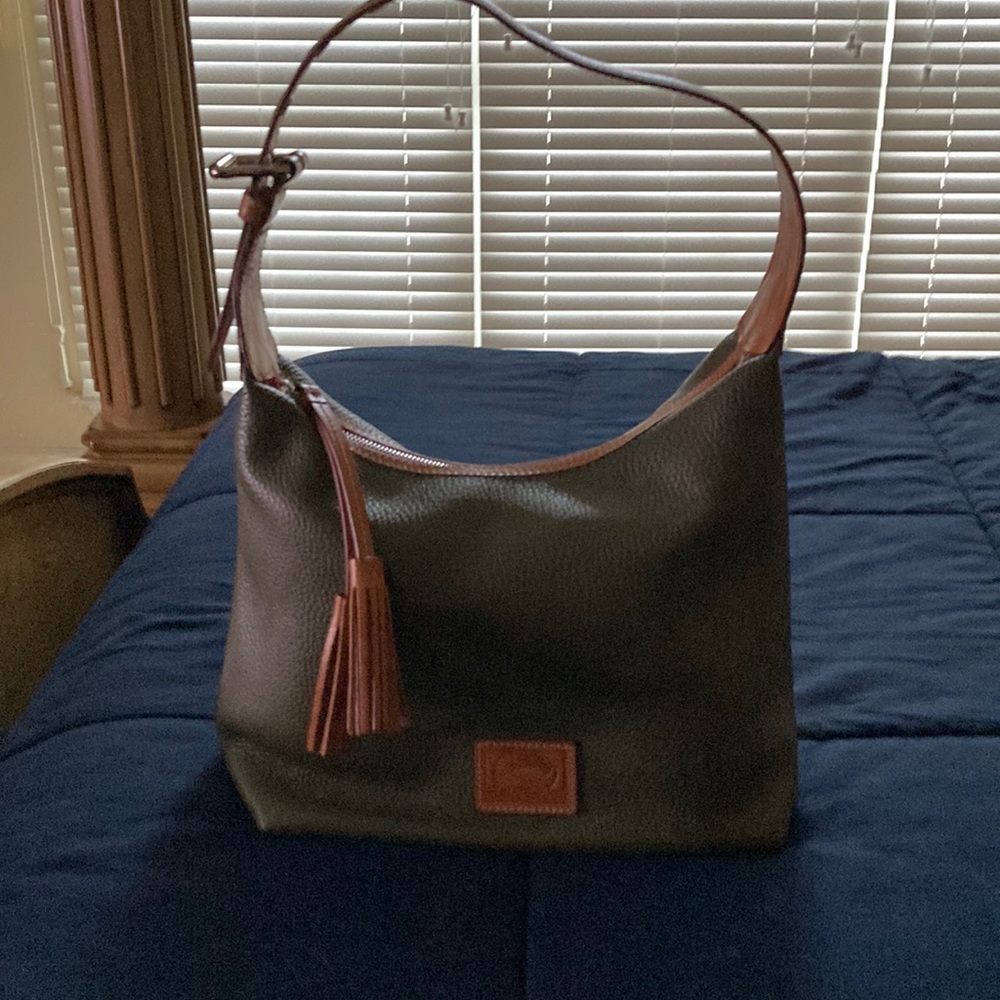 This bad is dark green with red interior, it has an adjustable strap